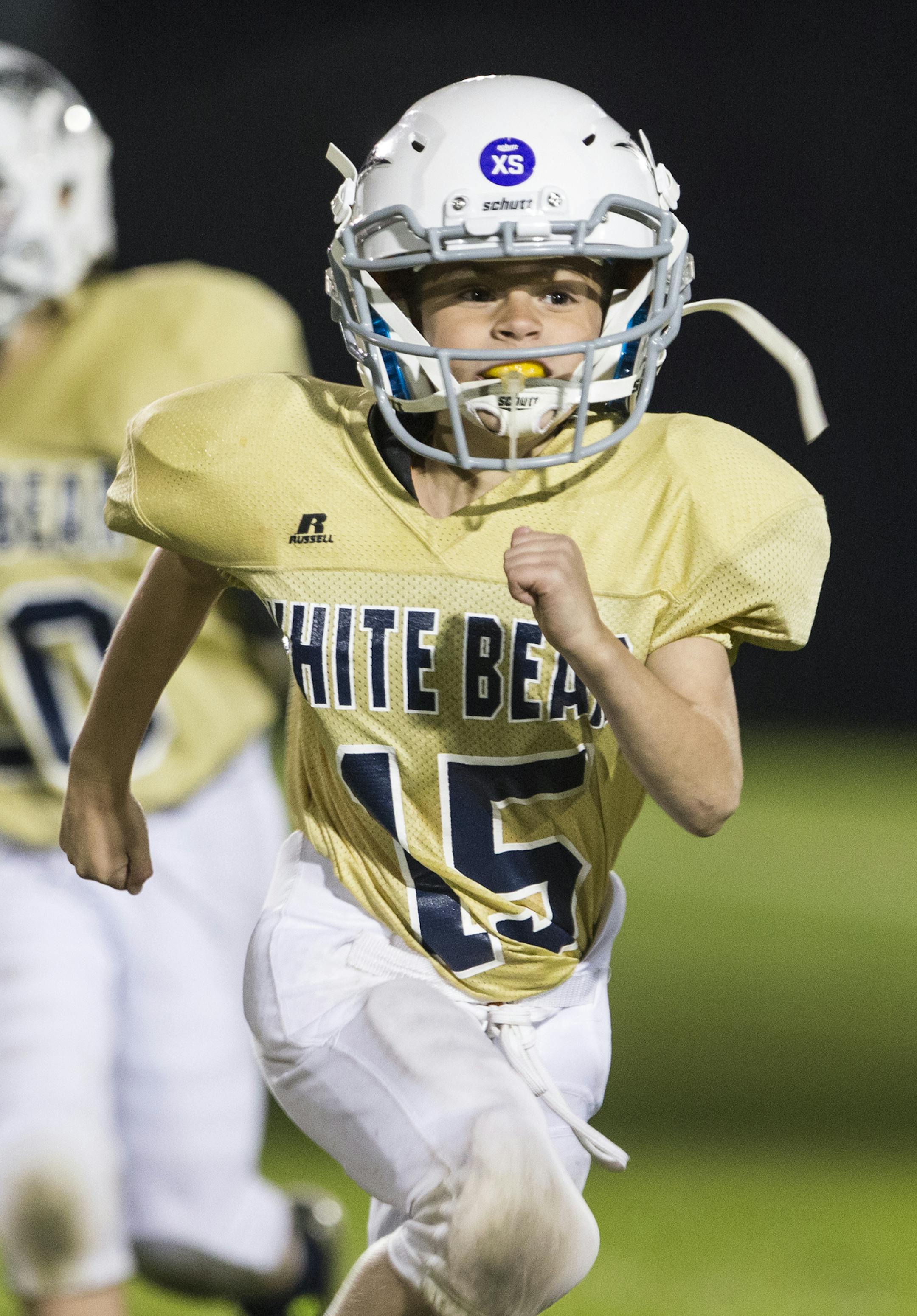 Dov Nathanson runs back to the sidelines after a play during a White Bear Lake youth football game at Podvin Park in White Bear Lake on Monday, October 5, 2015. ] (LEILA NAVIDI/STAR TRIBUNE) leila.navidi@startribune.com BACKGROUND INFORMATION: Dov Nathanson and his father David are both deaf and communicate with sign language. David also uses a drum to signal his son during youth football games.It's been 25 years since the passage of the American with Disabilities Act, yet the Nathanson family s