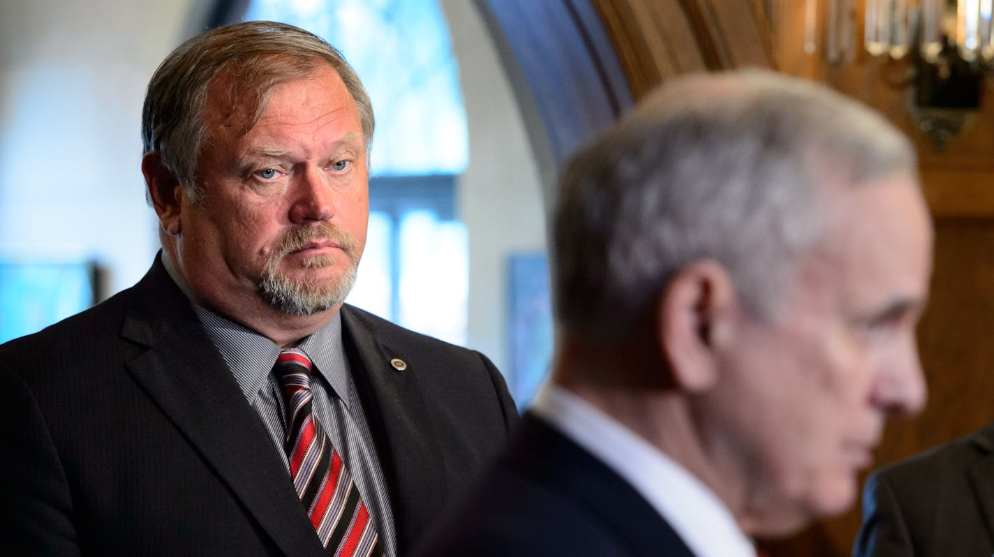 Senate Majority Leader Tom Bakk listens to Gov. Mark. Dayton on Thursday talk about obstacles to finalizing a budget deal. ] GLEN STUBBE * gstubbe@startribune.com Thursday, June 11, 2015 Governor Mark Dayton met privately with all four legislative caucus leaders at the Governor's Residence Thursday morning in hopes of nailing down a final agreement before the state draws any closer to a government shutdown and held a news conference after the meeting.