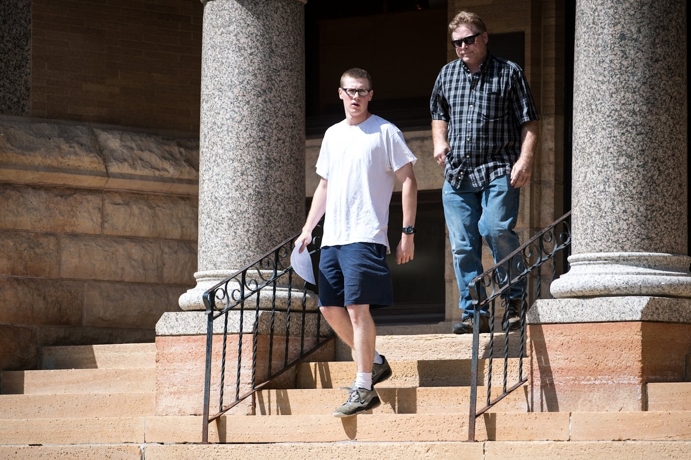 John Ladue and his father, David, walked down the steps in front of the Waseca County Courthouse.