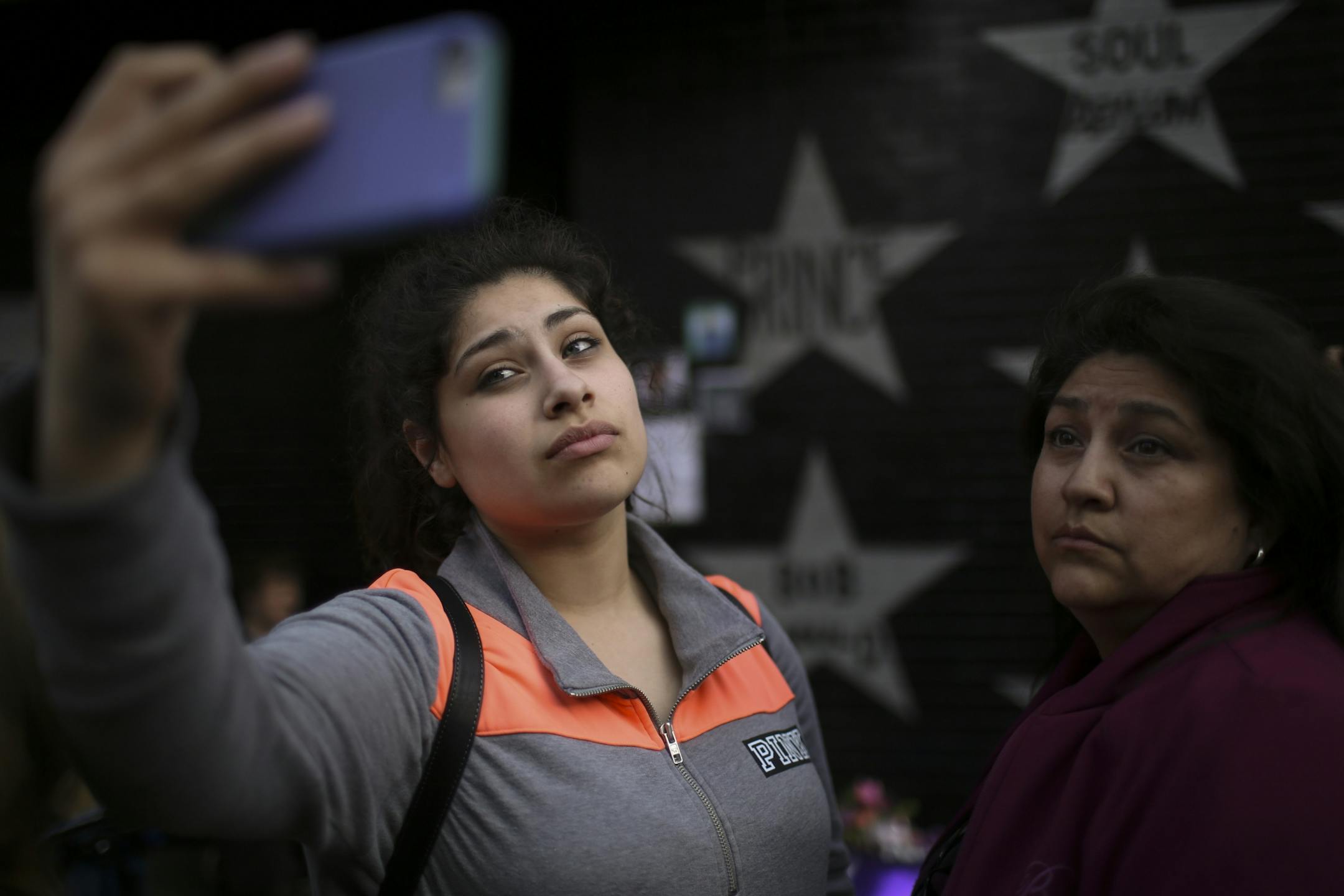 The growing memorial under Prince's star at First Ave. drew multitudes of fans throughout Tuesday afternoon and evening, including Maria Padilla and her mother, Teresa, of Lakeville.