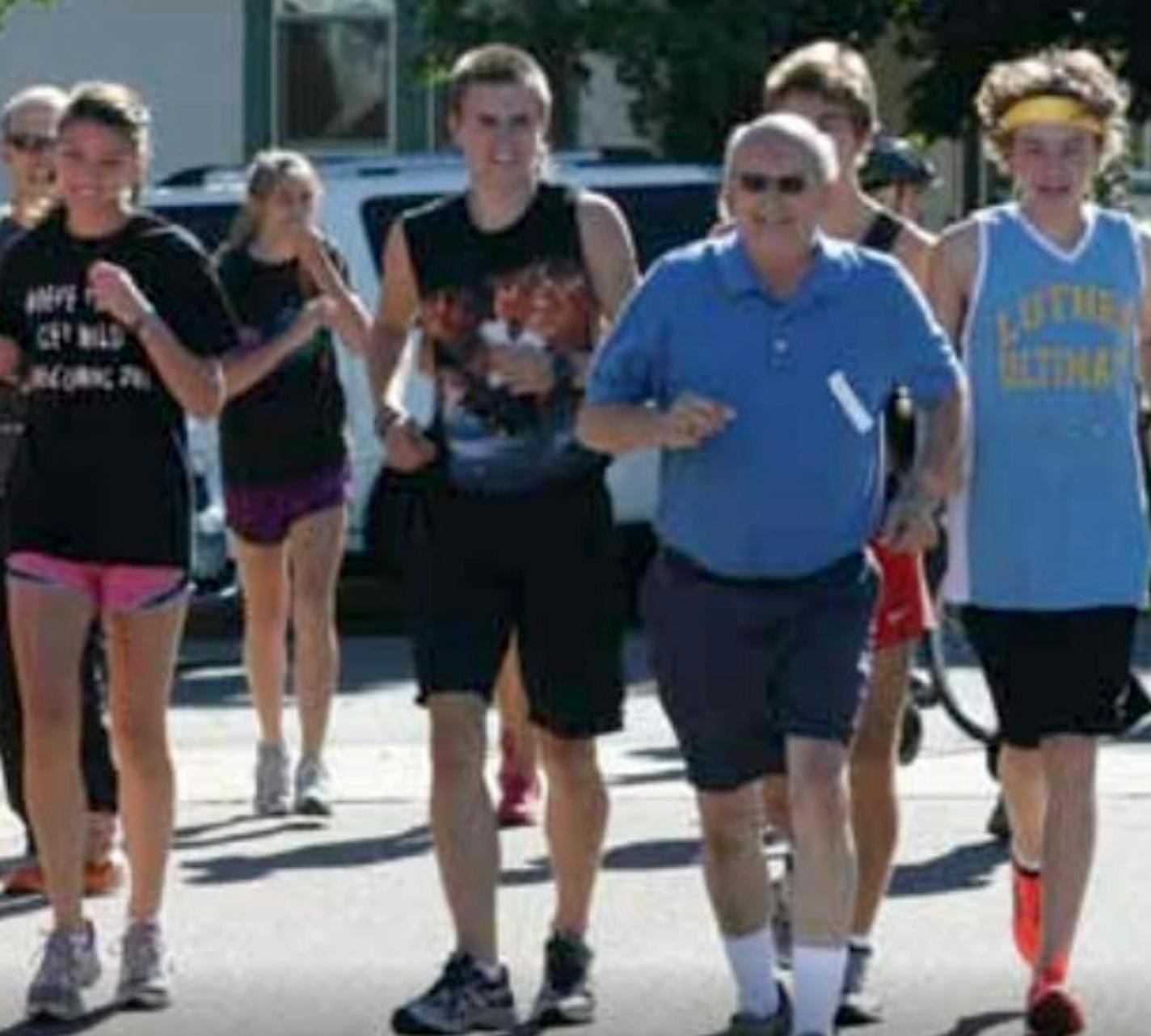 John Carlson pictured with the cross country team during the Redhawk Run. Carlson is presumed to be one of the victims in the natural gas explosion at Minnehaha Academy. This picture was taken in 2011.