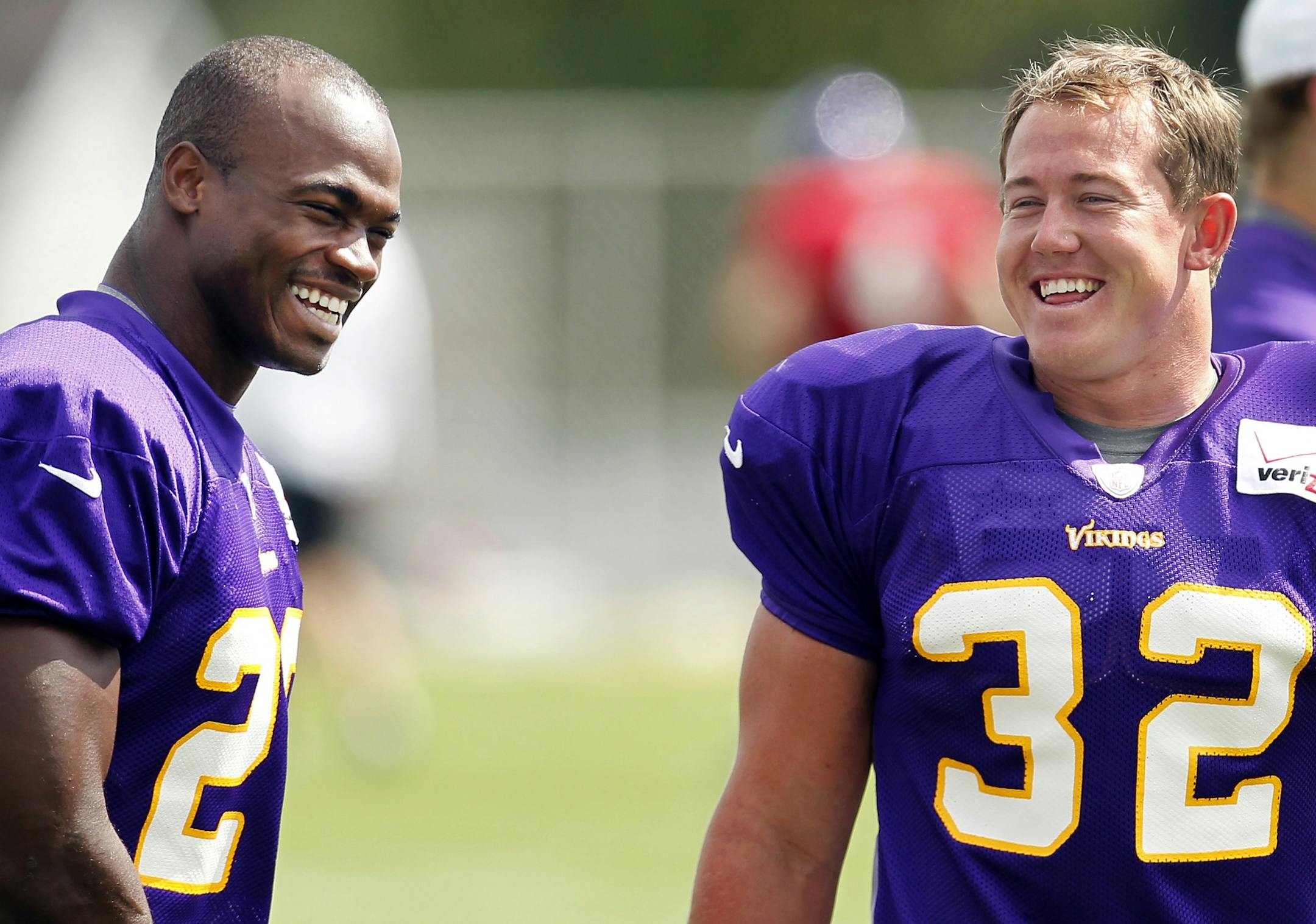 Minnesota Vikings running backs Adrian Peterson (28) and Toby Gerhart (32) joked during the afternoon practice on Monday. .