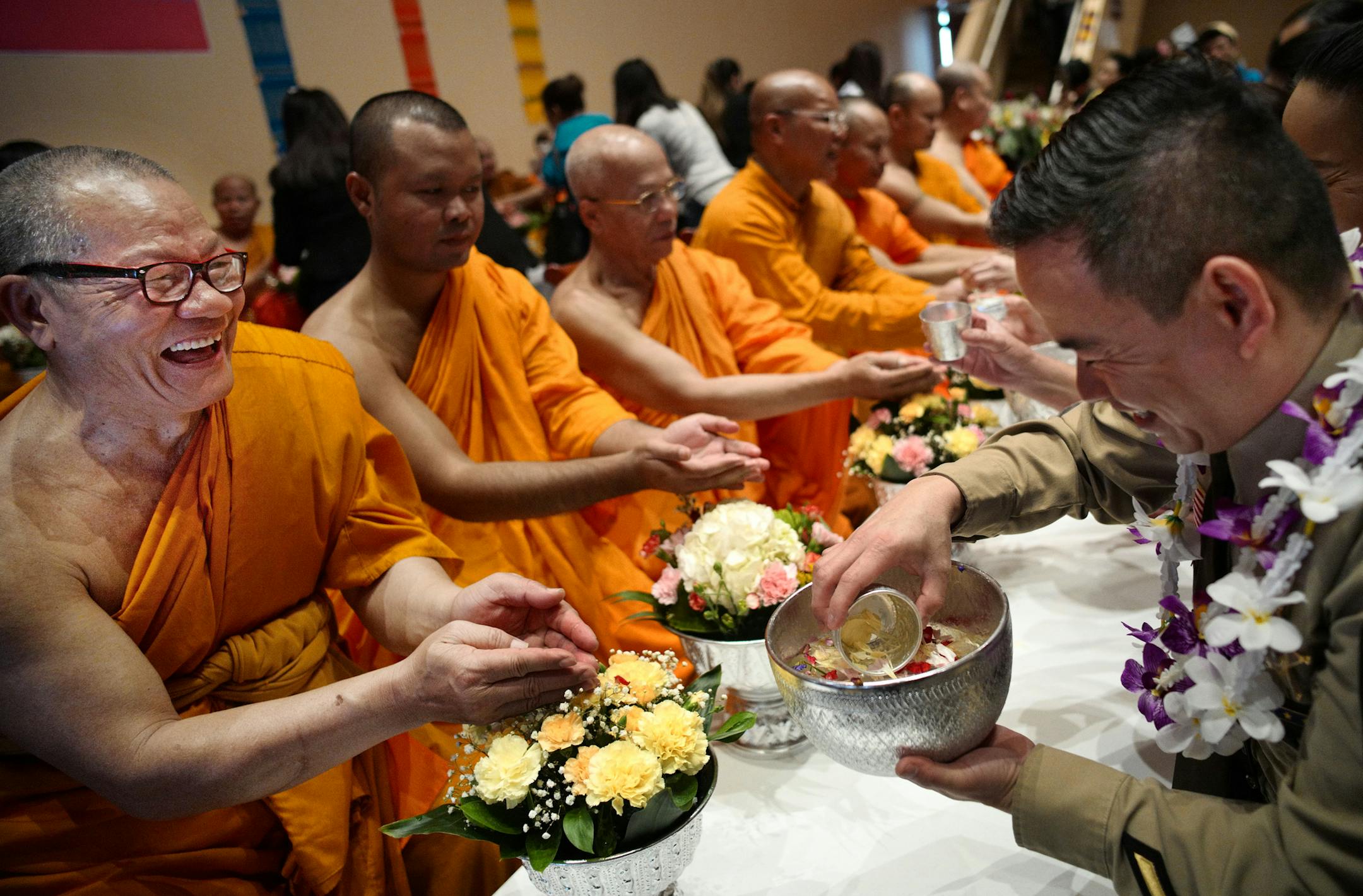 Buddhist monk Phraathikan Prapatphan Ritsakunwong participated in a water blessing with Thuan Vuong, a deputy from the Hennepin County Sherriff.]Wat Thai of Minnesota is having their Thai New Year celebration at their new temple space in St. Louis Park. Richard Tsong-Taatariiïrichard.tsong-taatarii@startribune.com