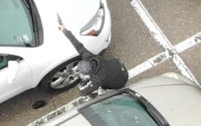 Surveillance footage shows an armed man pointing a handgun at police following a standoff outside the Target store in Woodbury. Police shot the man, a