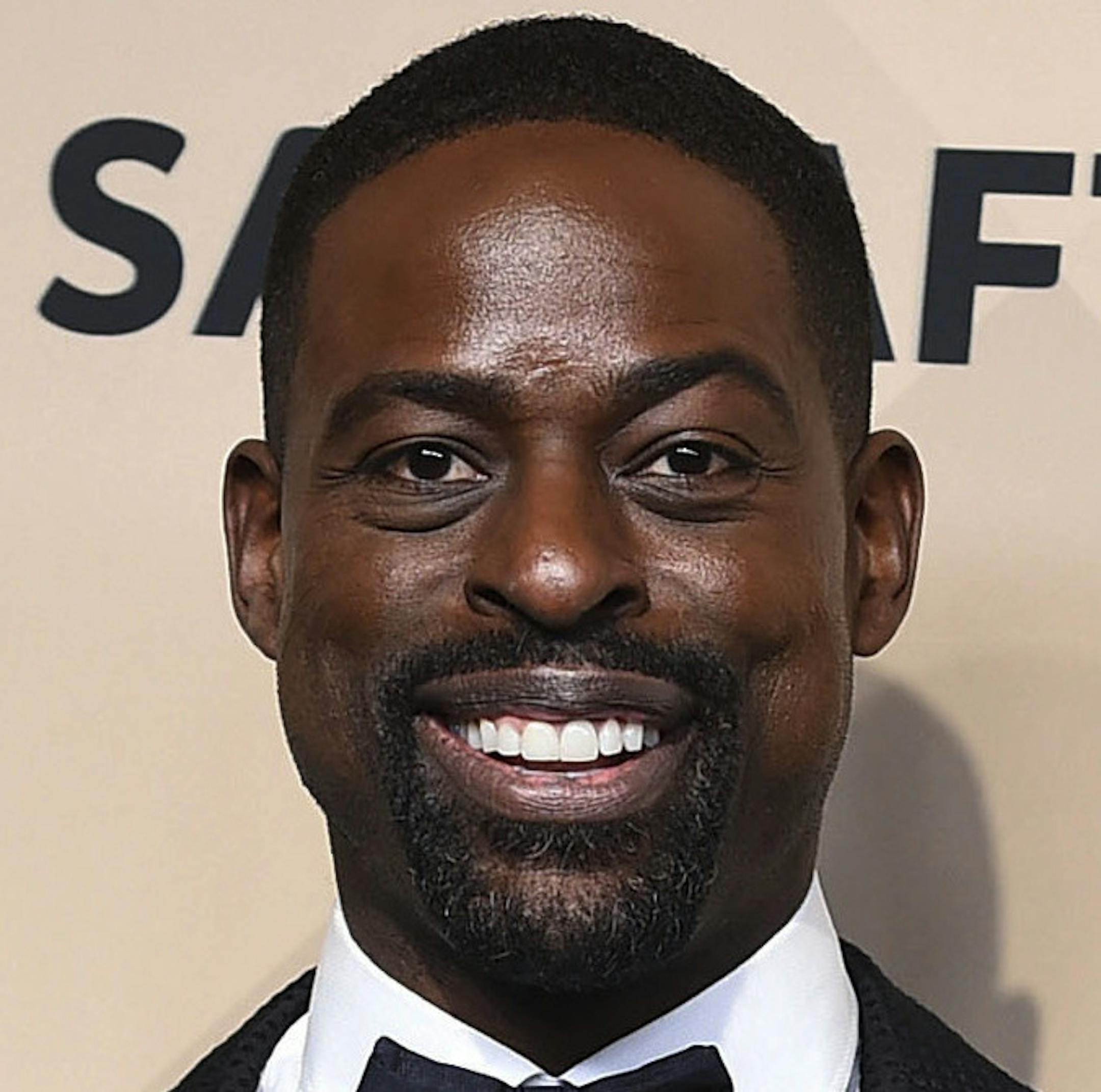 Sterling K. Brown, winner of the awards for outstanding performance by a male actor in a drama series for "This Is Us" and for outstanding performance by an ensemble in a drama series for "This Is Us", poses in the press room at the 24th annual Screen Actors Guild Awards at the Shrine Auditorium & Expo Hall on Sunday, Jan. 21, 2018, in Los Angeles. (Photo by Jordan Strauss/Invision/AP)