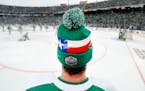 Dallas Stars right wing Alexander Radulov wears a Texas Winter Classic stocking cap during warmups before their outdoor Winter Classic game with the N
