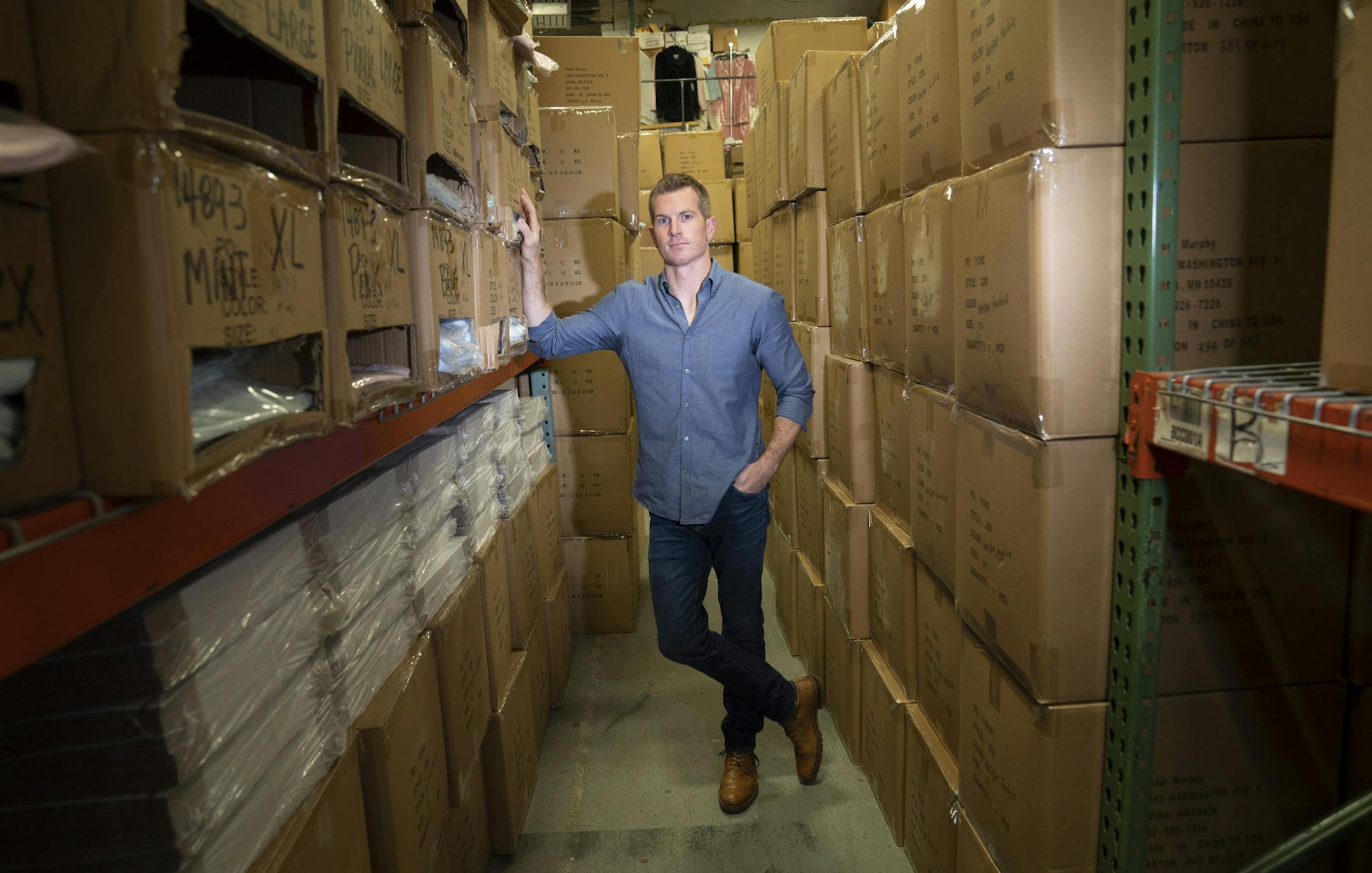 Tim Murphy, president of Softies, posed for a photo in the stacked boxes of their Edina warehouse, boxes that will all be sent in the next week after making Oprah's Favorite Things list three years in a row. Photographed in Edina, Minn., on Wednesday, November 20, 2019. ] RENEE JONES SCHNEIDER &#x2022; renee.jones@startribune.com