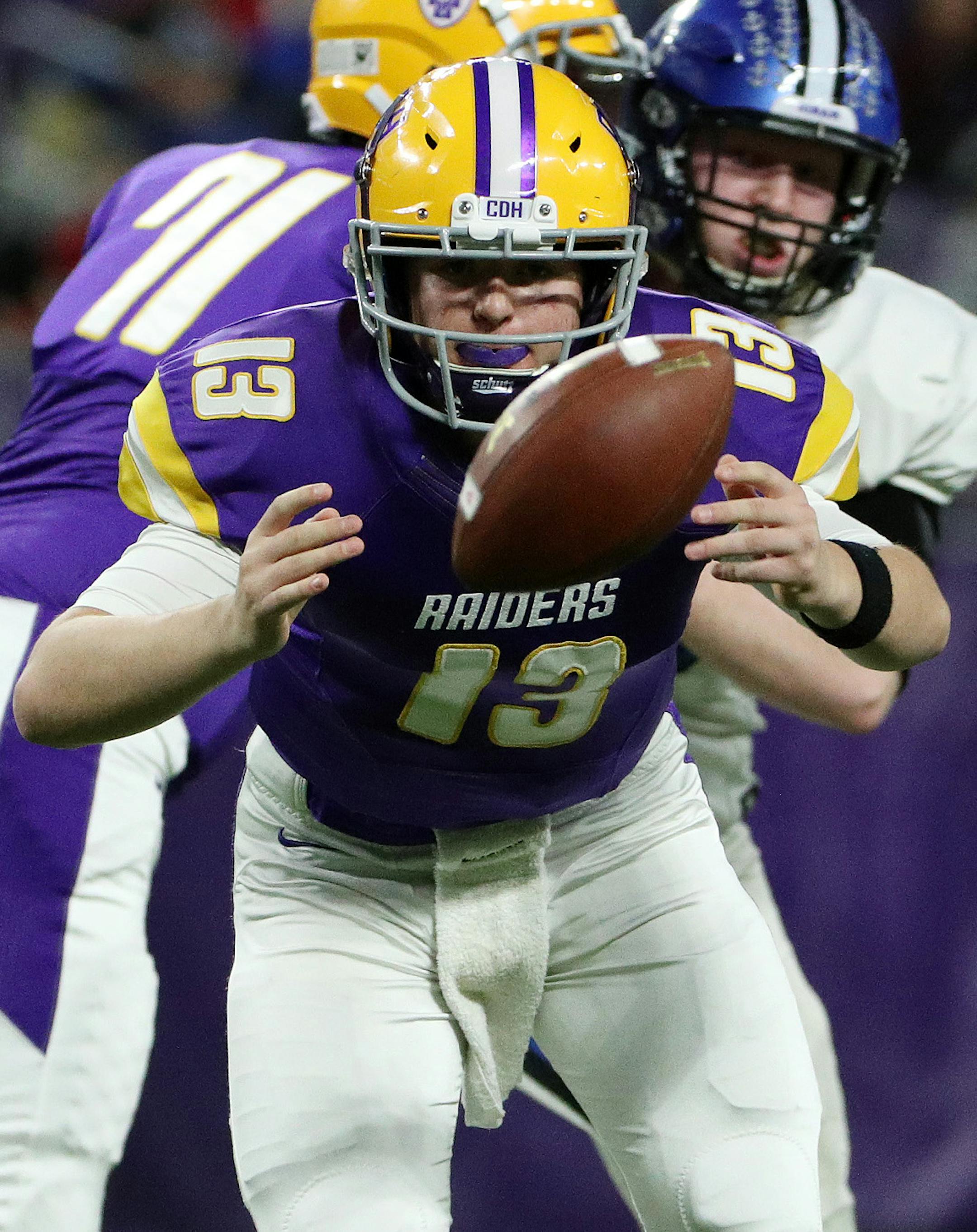 Cretin-Derham Hall High School quarterback Danny Callahan (13) passed the ball off to Cretin-Derham Hall High School running back Tony Underwood (8) in the first half. ] ANTHONY SOUFFLE ï anthony.souffle@startribune.com Game action from a Class 6A semifinal football game between Minnetonka High School and Cretin-Derham Hall High School Friday, Nov. 17, 2017 at U.S. Bank Stadium in Minneapolis.