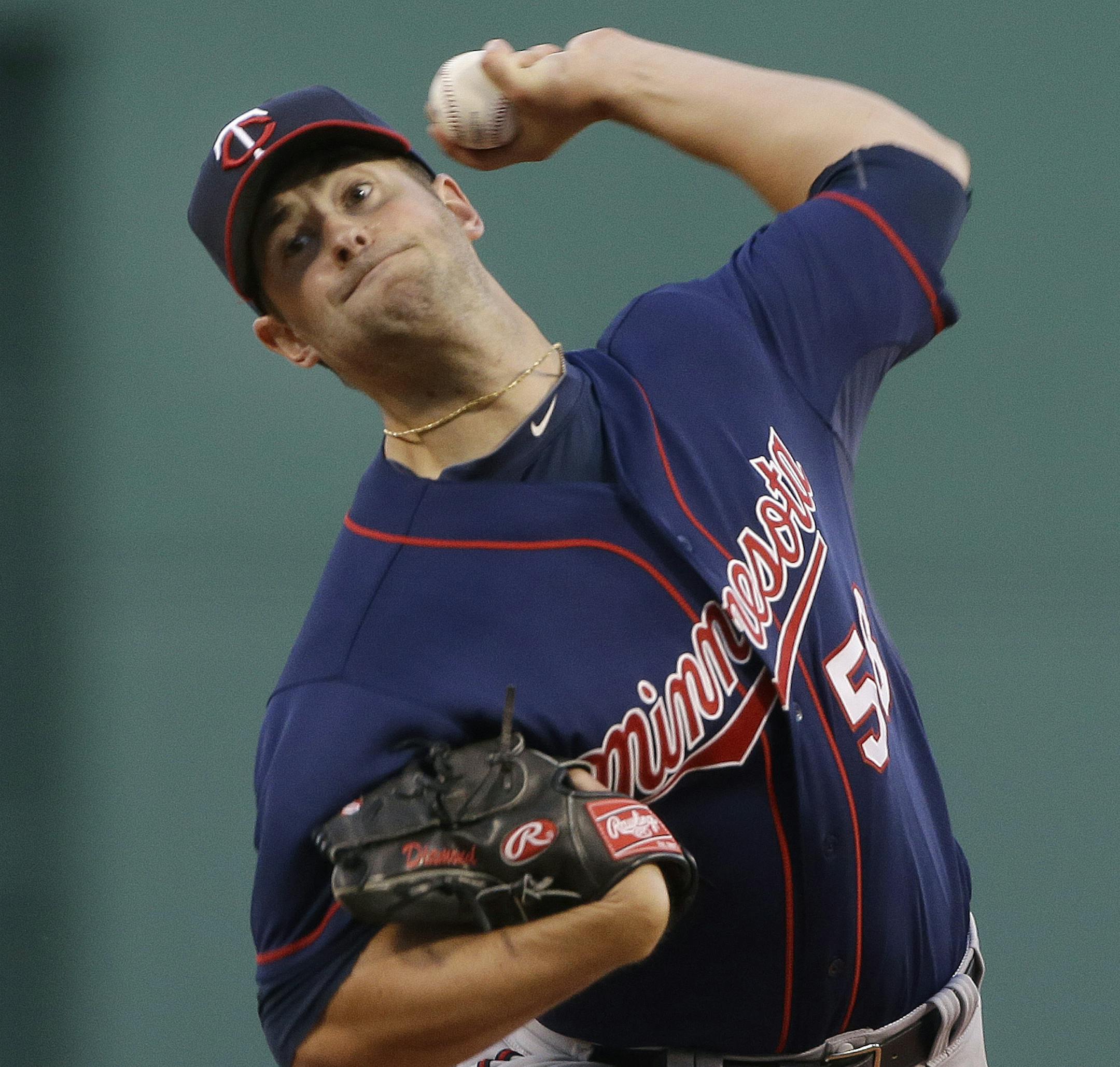 Minnesota Twins starting pitcher Scott Diamond delivers to the Boston Red Sox during the first inning of a baseball game at Fenway Park in Boston, Tuesday, May 7, 2013. (AP Photo/Elise Amendola)