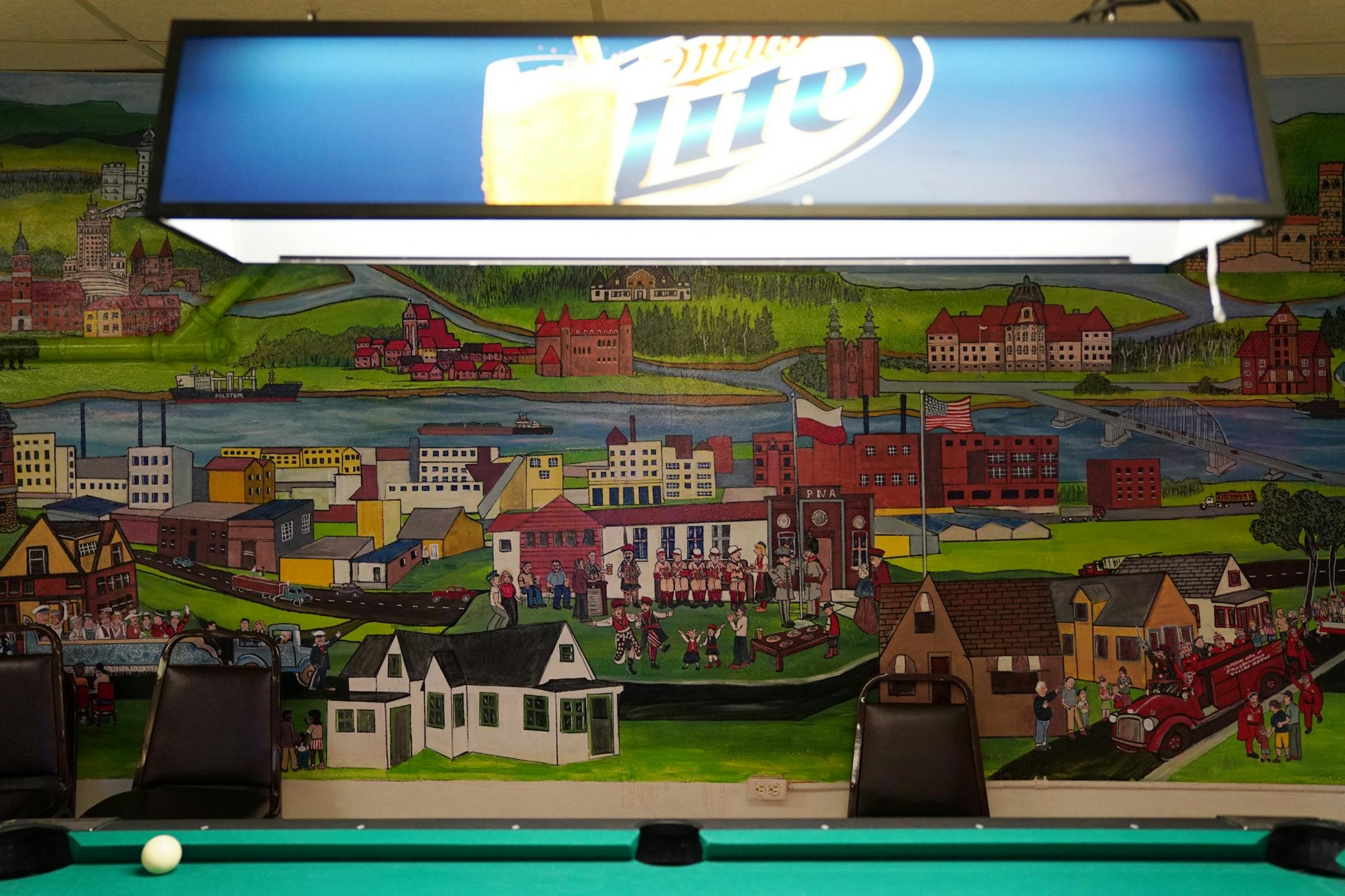 A mural with the Polish National Alliance sitting dead center covers the wall behind the pool table as regulars drank during a quiet Thursday night.