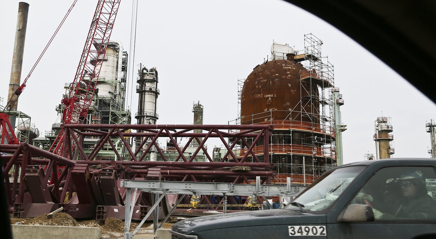 Flint Hills Refinery is undergoing a $400 million upgrade to improve its output and is announcing a $300 million energy-saving project, says it will begin generating half its electricity from waste heat. It also plans to install technology to produce fertilizer as a byproduct when refining gasoline. Up to 2000 additonal construction workers are onsite working on the projects.The Flint Hills Refinery was seenTuesday, March 18, 2014, in Inver Grove Heights, MN.](DAVID JOLES/STARTRIBUNE) djoles@sta