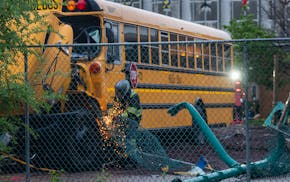 Two children at a playground were hospitalized with non-life-threatening injuries after a school bus crashed into them Monday afternoon in south Minne