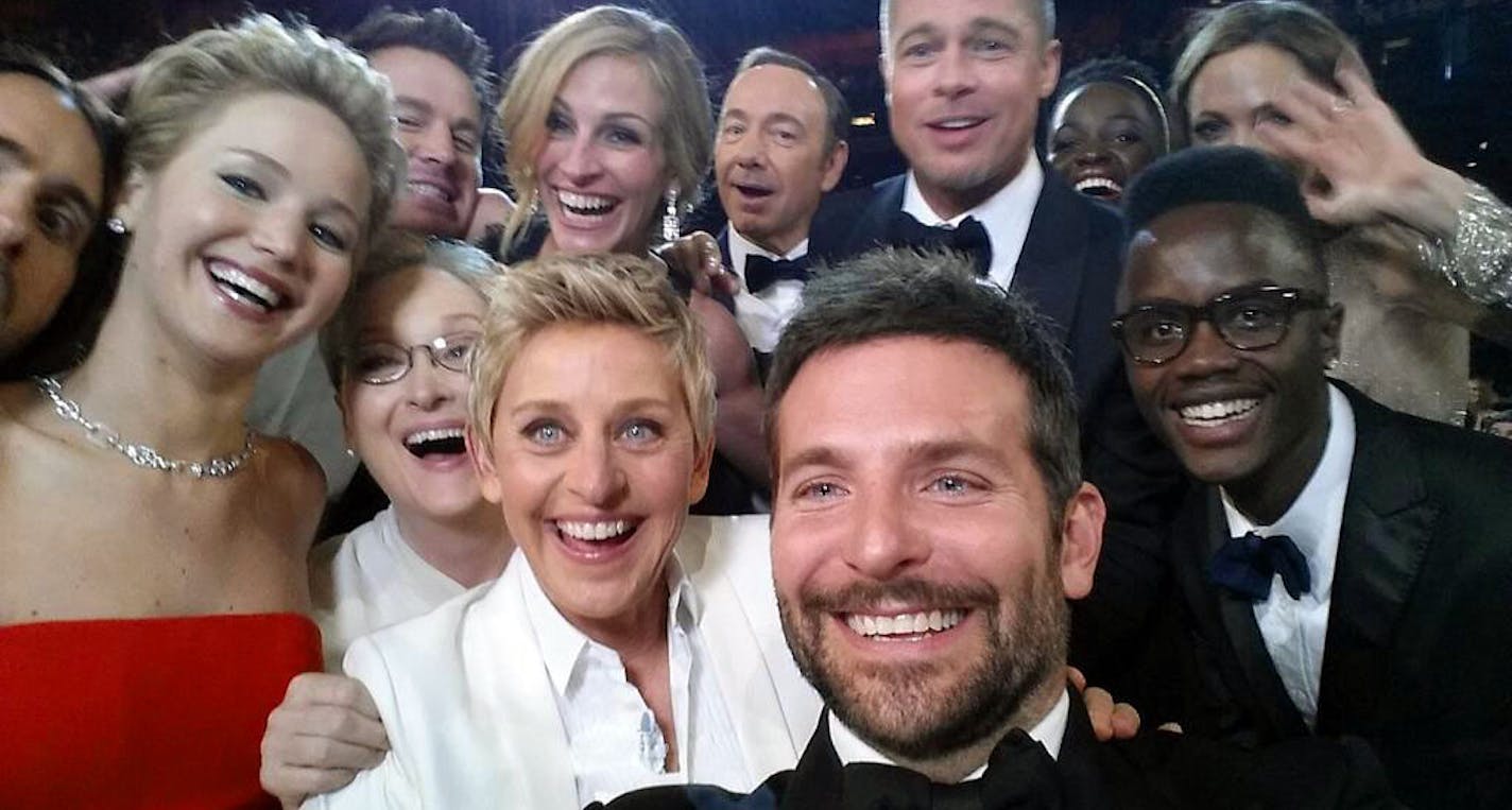 FOR USE AS DESIRED, YEAR END PHOTOS - FILE - This image released by Ellen DeGeneres shows actors front row from left, Jared Leto, Jennifer Lawrence, Meryl Streep, Ellen DeGeneres, Bradley Cooper, Peter Nyong'o Jr., and, second row, from left, Channing Tatum, Julia Roberts, Kevin Spacey, Brad Pitt, Lupita Nyong'o and Angelina Jolie as they pose for a "selfie" portrait on a cell phone during the Oscars at the Dolby Theatre on Sunday, March 2, 2014, in Los Angeles. (AP Photo/Ellen DeGeneres, File)