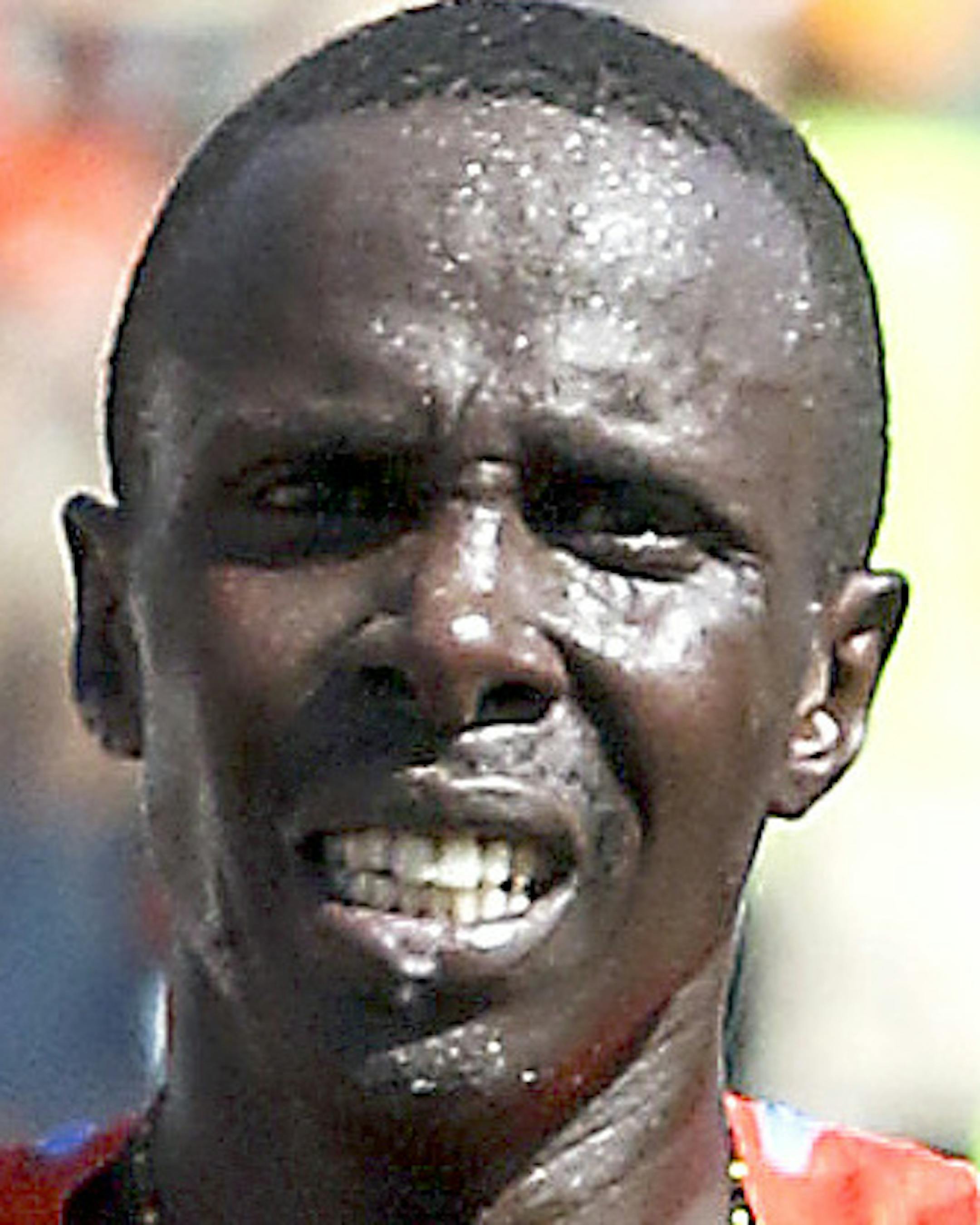 t061816 --- Clint Austin --- austinGMA0619c --- Kenya&#xed;s Elisha Barno celebrates at the finish line of Grandma's Marathon in Duluth Saturday. Barno repeated his championship with at time of 2 hours, 11 minutes, 26 seconds. (Clint Austin / caustin@duluthnews.com)