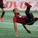Atlanta United forward Josef Martinez (7) battles for there ball in the first half of an MLS soccer game against the D.C. United on Sunday, March 11, 