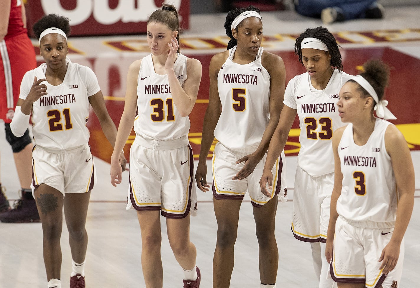 Jasmine Brunson (21), Irene Garrido Perez (31), Taiye Bello (5), Kenisha Bell (23) and Destiny Pitts (3) walked off the court at the end of the game. Ohio State beat Minnesota 65-55.