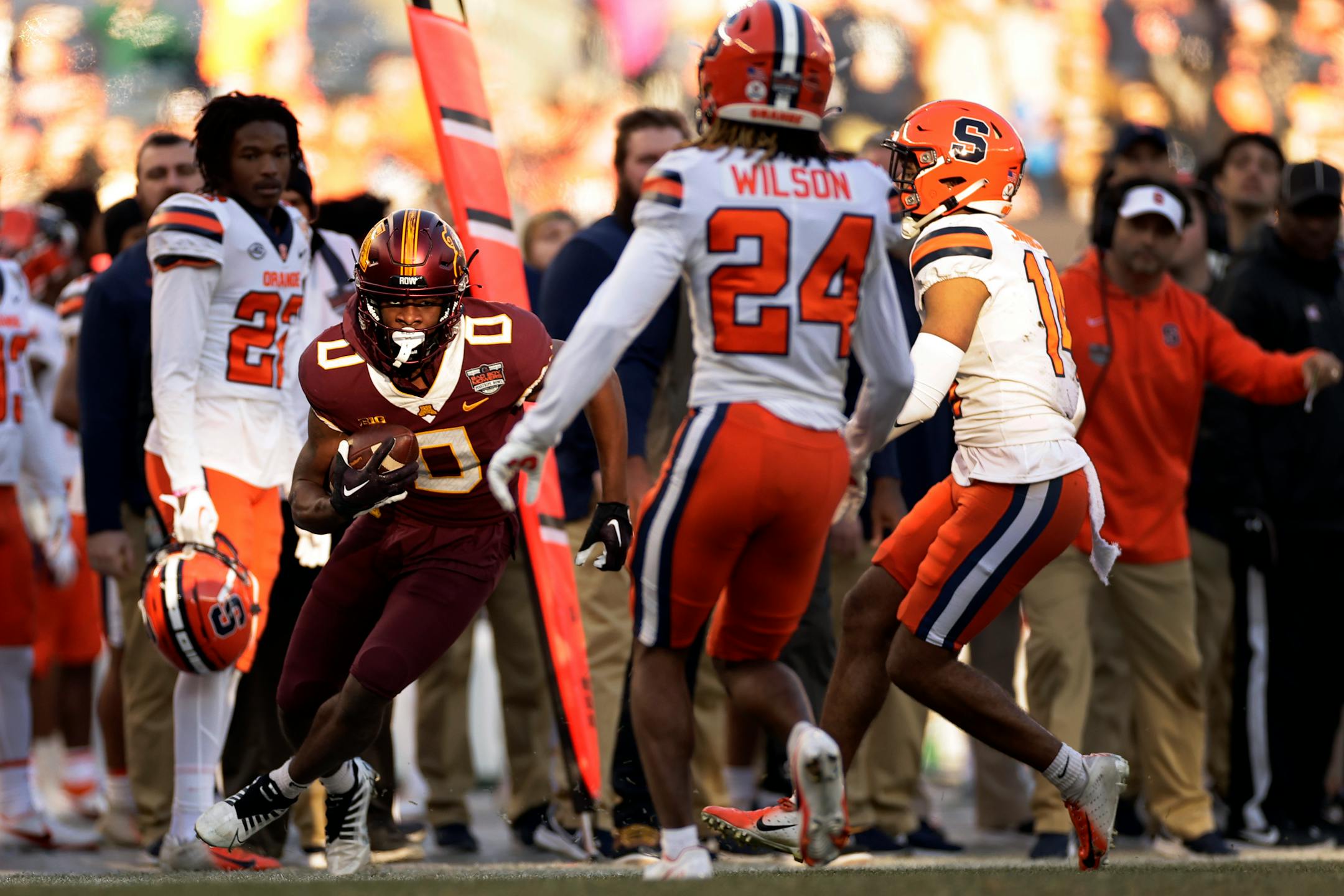 Minnesota wide receiver Le'Meke Brockington (0) runs toward Syracuse defensive back Jeremiah Wilson (24) during the first half.