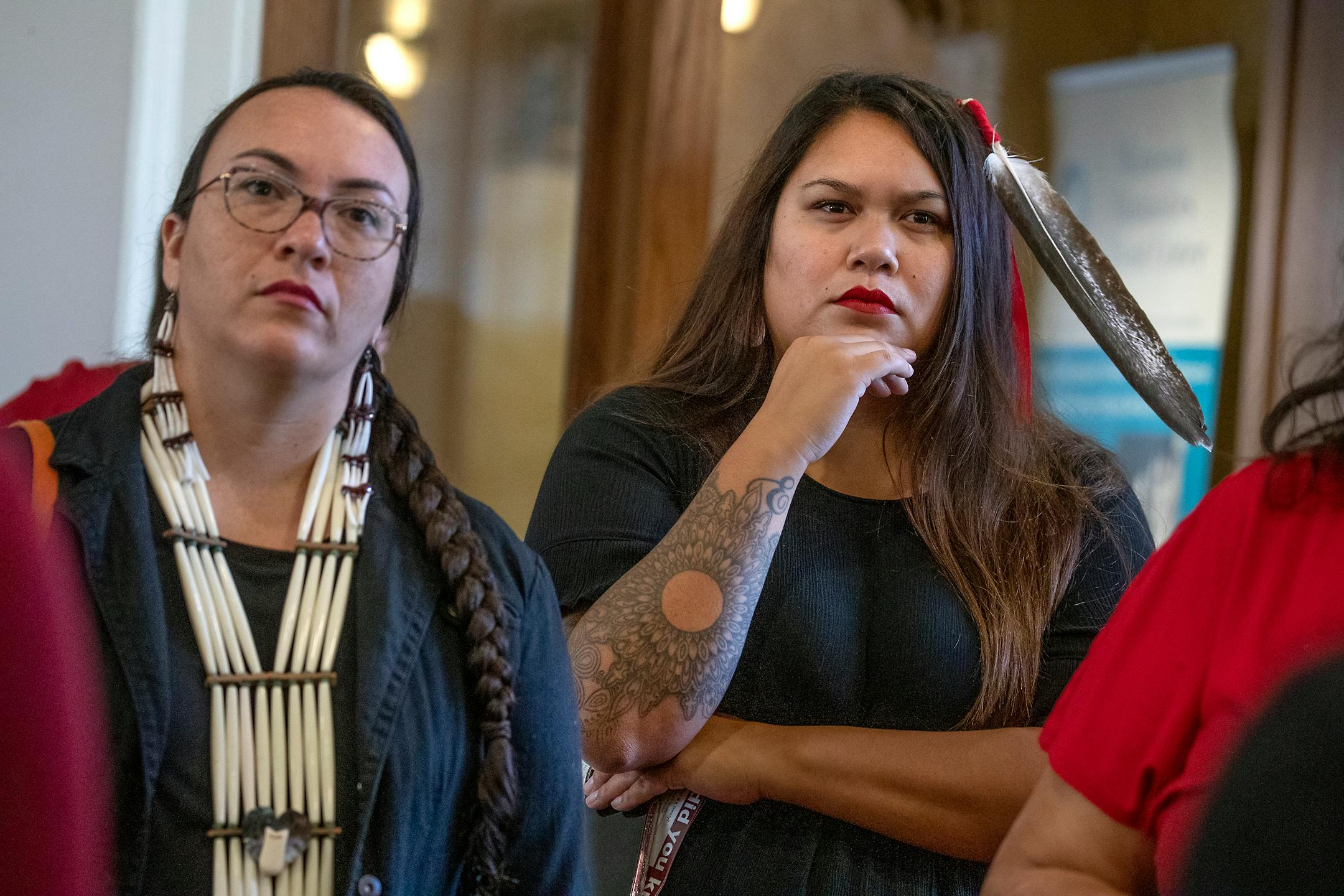 Autumn Dillie of the Turtle Mountain Indian Reservation of North Dakota, right, and Maggie Lorenz, left, listened to emotional testimony by speakers during a ceremonial bill signing to launch the first official meeting of the MMIW Task Force, Thursday, September 19, 2019 in St. Paul, MN. ] ELIZABETH FLORES • liz.flores@startribune.com