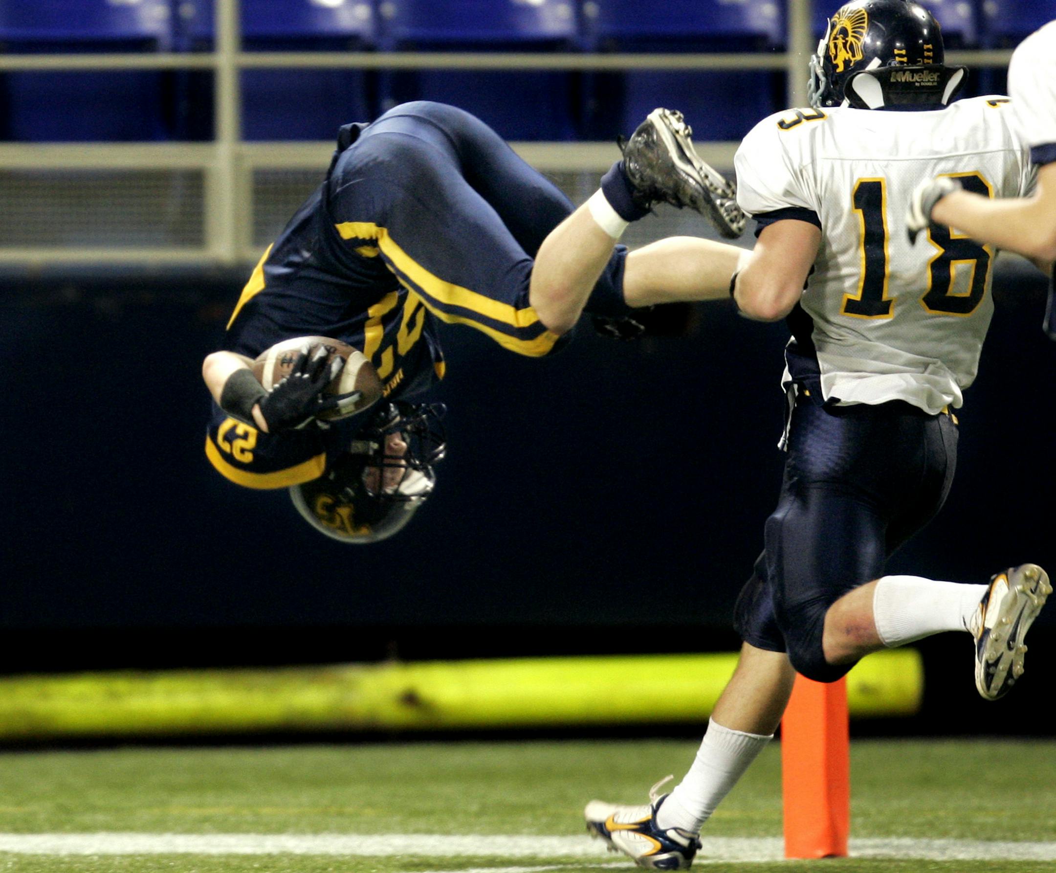 JEFFREY THOMPSON ï§jthompson@startribune.com Minneapolis, MN - Nov. 24, 2007 - 00000447C Totino-Grace's Micah Koehn dove into the endzone to score his team's winning touchdown on the last play of the game, defeating Mahtomedi 13-8 for the Class 4A Prep Bowl title Saturday.