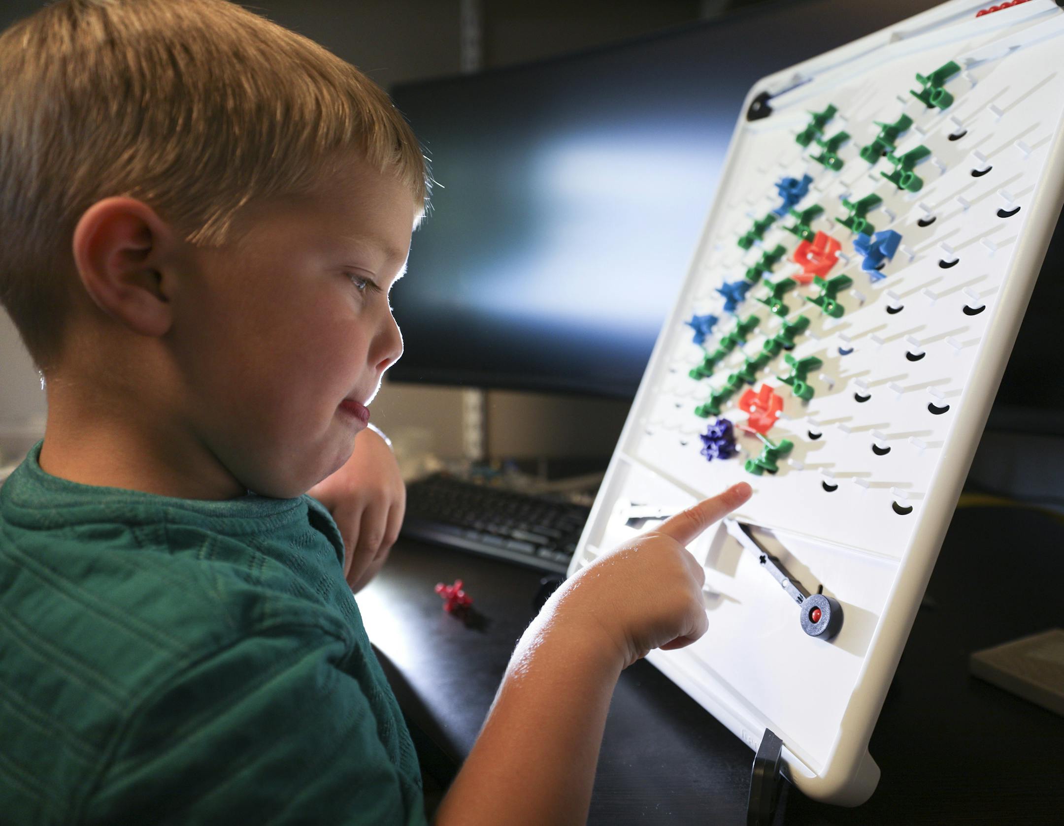 Alyssa and Paul Boswell, inventors of Turing Tumble a hot new game for kids that teaches computer basics -- without using a screen. Son Henry, 4 , plays the games in their "World Headquarters" in a basement bedroom of their Shorview home. BRIAN PETERSON &#x2022; brian.peterson@startribune.com
Shorview, MN 08/02/2018