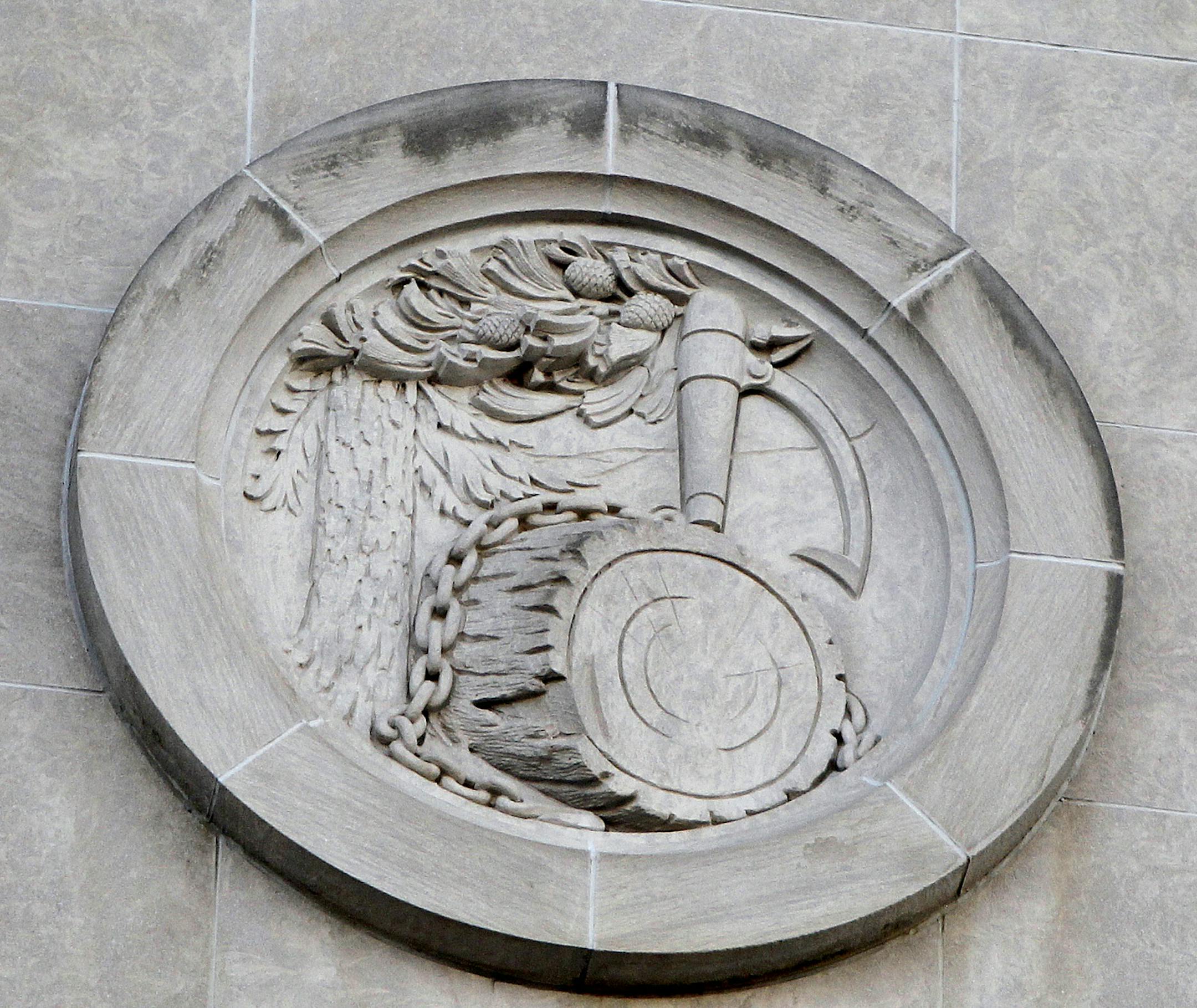 Construction crew from Ryan were beginning the process of removing medallions from front of Star Tribune building, Monday, February 10, 2014 in Minneapolis, MN. ] (ELIZABETH FLORES/STAR TRIBUNE) ELIZABETH FLORES • eflores@startribune.com