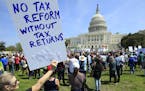 Protesters are gather on Capitol Hill in Washington, Saturday, April 15, 2017, during a Tax Day demonstration calling on President Donald Trump to rel