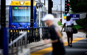 Passengers get on and off the light rail at the Capitol / Rice Street Station, Green Line light rail in St. Paul.
