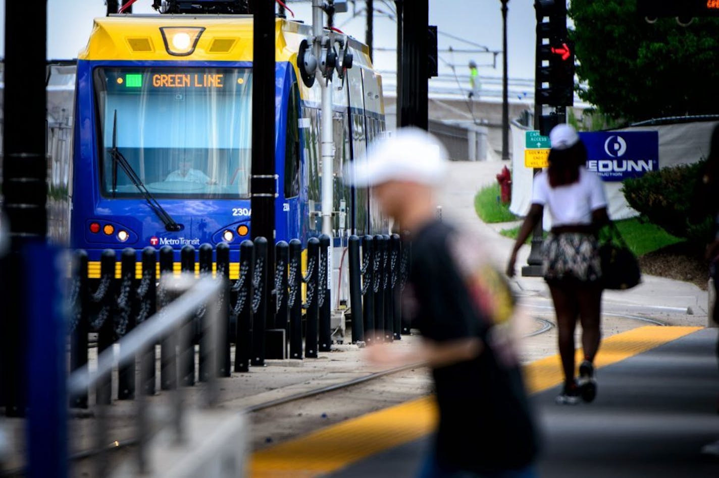 Passengers get on and off the light rail at the Capitol / Rice Street Station, Green Line light rail in St. Paul.