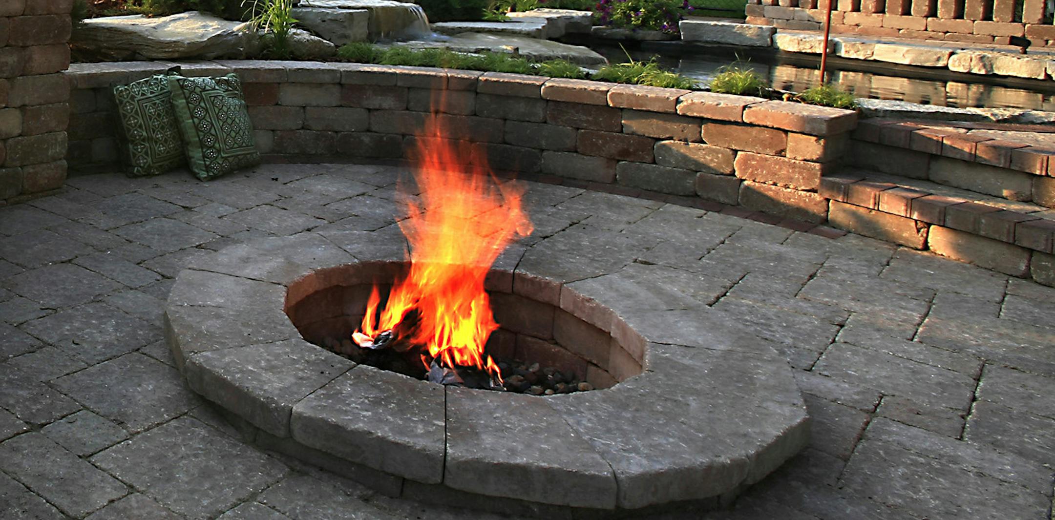 STEVE RICE \u2022 srice@startribune.com Plymouth, MN. - Brett Hanson wanted the \u201Clook of an old European courtyard\u201D in his back yard. So instead of putting in a concrete slab, Bachman\u2019s landscape designer Daryl Malmquist created an \u201Coutdoor room\u201D for Hanson with a fire pit for those chilly Midwest nights. ORG XMIT: ORG XMIT: MIN2013042513441742