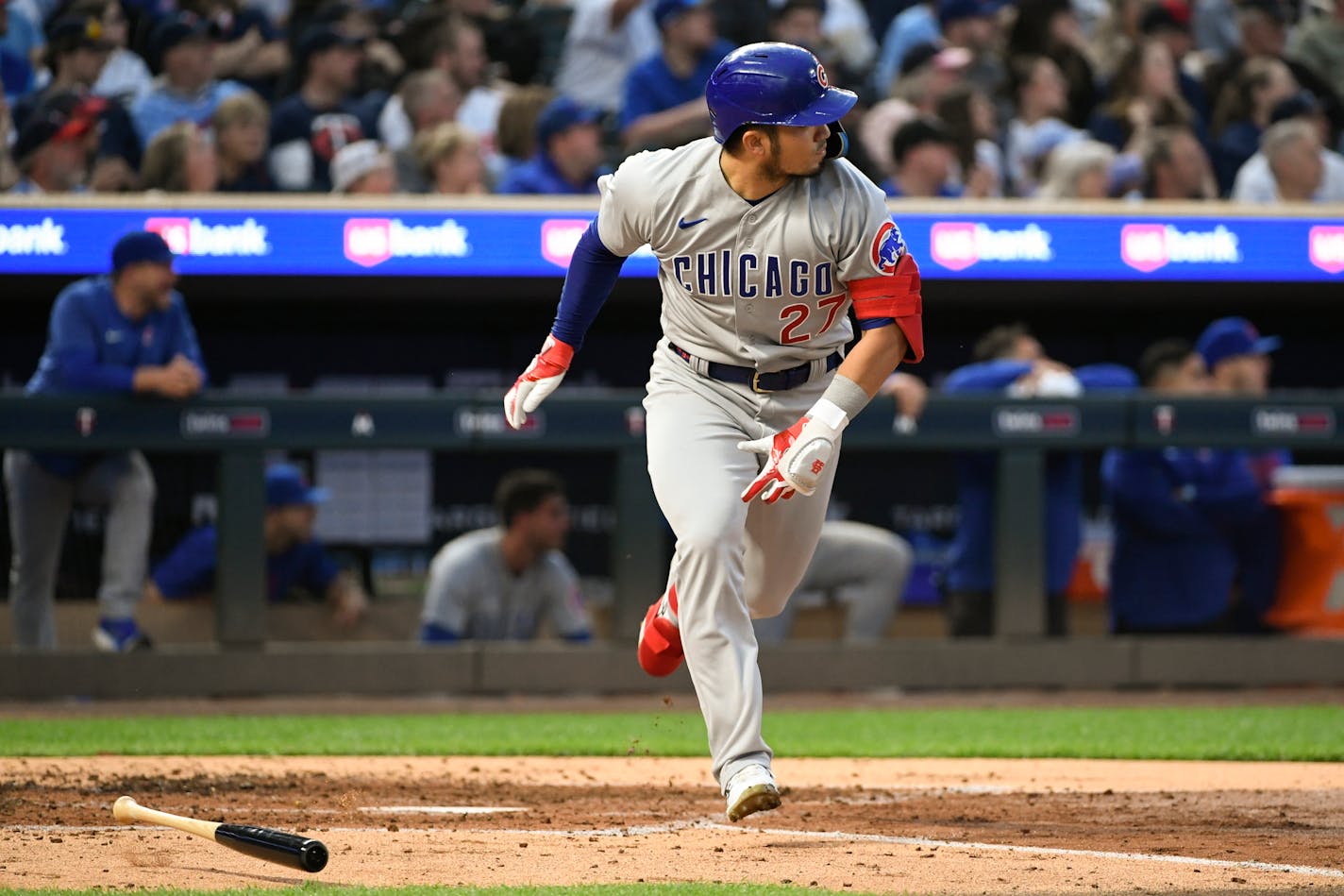 Chicago Cubs' Seiya Suzuki watches his sacrifice fly to center that drove in Dansby Swanson for a run against the Minnesota Twins during the fourth inning of a baseball game, Friday, May 12, 2023, in Minneapolis. (AP Photo/Craig Lassig)