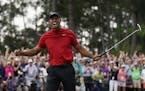 Tiger Woods reacts as he wins the Masters golf tournament Sunday, April 14, 2019, in Augusta, Ga.