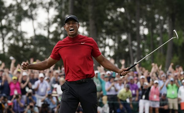 Tiger Woods reacts as he wins the Masters golf tournament Sunday, April 14, 2019, in Augusta, Ga.