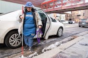 Rachel Eggert, a legally deaf and blind person, got out of a Lyft at the Timberwolves game in Minneapolis on Friday. Eggert is one of thousands of Min