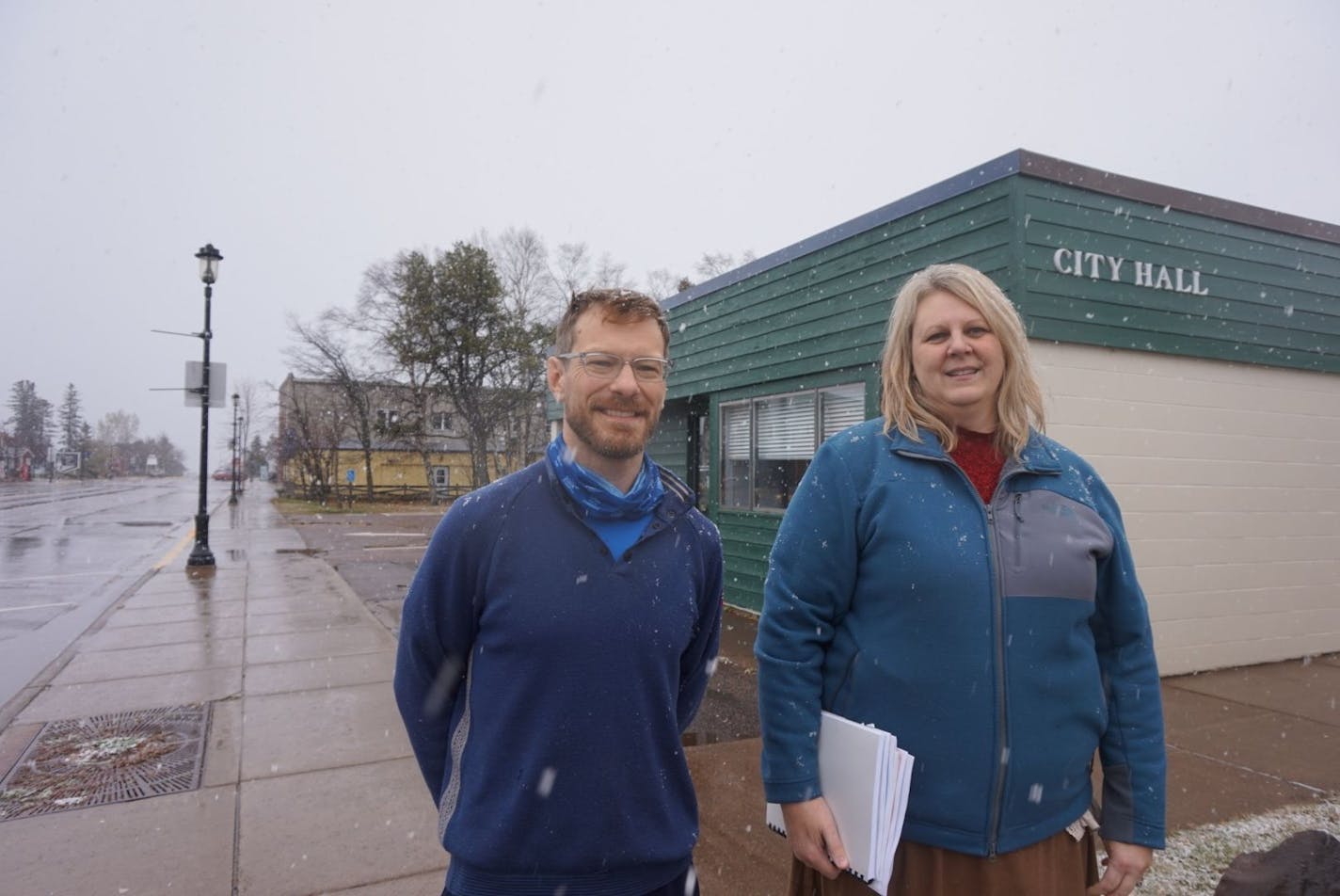 Jay Arrowsmith DeCoux and Kelly Swearingen, outside Grand Marais' City Hall, will go head-to-head in the city's mayor election.