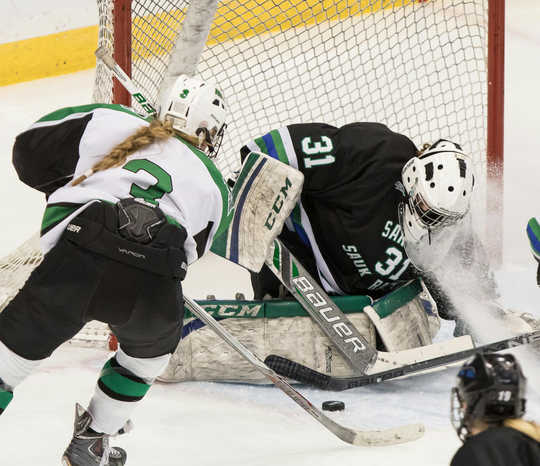 Sartell-Sauk Rapids goaltender Clare Minnerath (31) is sprayed with ice while making a save in the quarterfinals of the 2016 MSHSL Girls' Hockey Tournament on February 18, 2016 St. Paul, Minnesota. ] Special to Star Tribune MATT BLEWETT ï matt@mattebphoto.com - February 18, 2016, St. Paul, MN, Sartell-Sauk Rapids Stormin Sabres, Hill-Murray Pioneers, MSHSL Girls' Hockey, 303744 PREP021916
