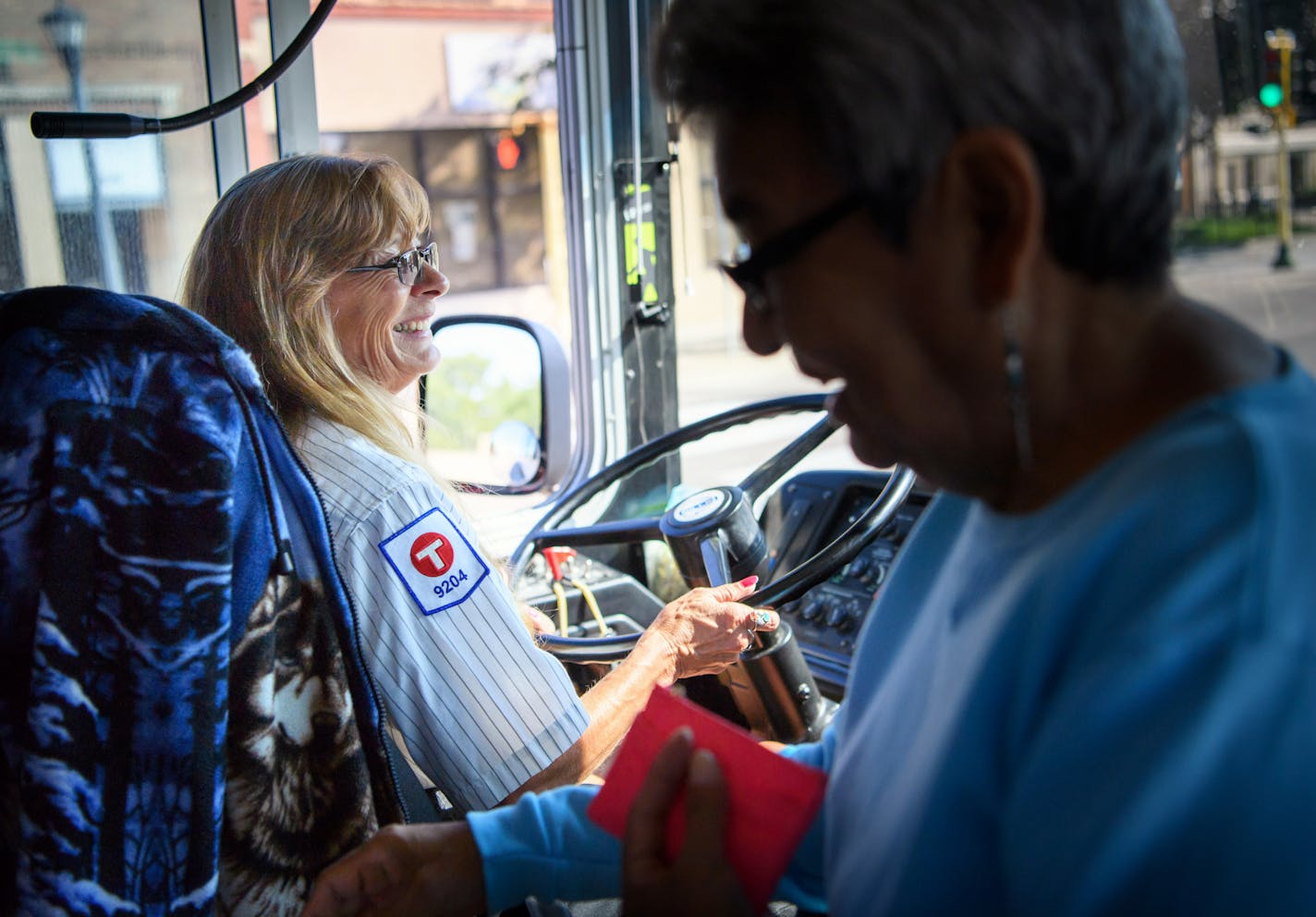 Diane Rude drove her Metro Transit bus along route 14E Friday morning, often greeting passenters with a smile and a wave. The Woodbury resident was assaulted by a deranged passenger. ] GLEN STUBBE * gstubbe@startribune.com Friday, September 2, 2016 Diane Rude, a Woodbury resident who was assaulted by a deranged passenger, is driving the 14E Line through Minneapolis on Friday morning.