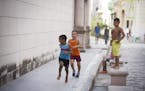 Boys play in the street in Old Havana, Cuba on Wednesday, May 13, 2015.