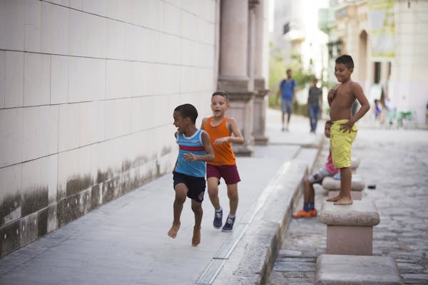 Boys play in the street in Old Havana, Cuba on Wednesday, May 13, 2015.
