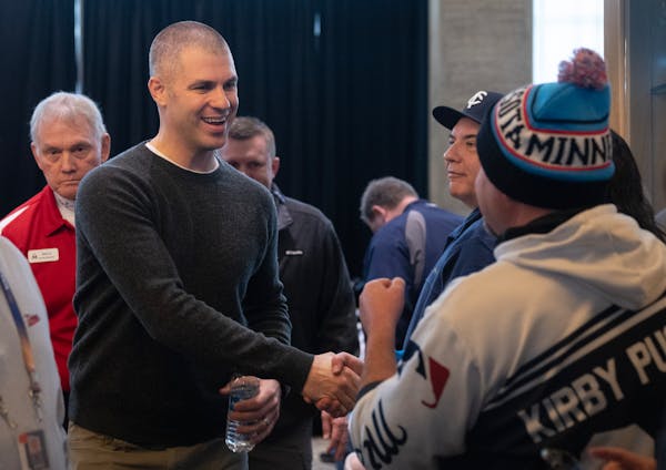 Joe Mauer greeted fans during TwinsFest at Target Field on Saturday in what he described as a "very emotional" experience.