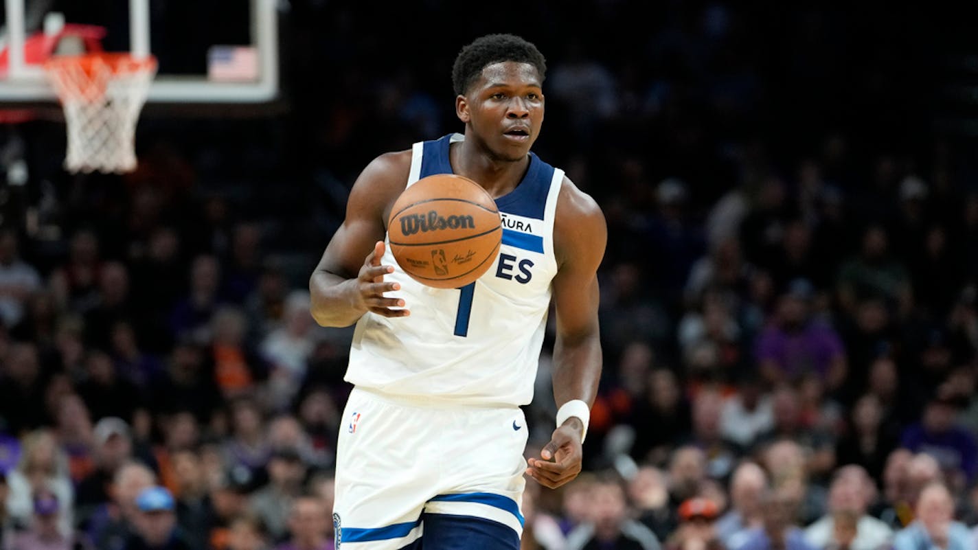 Minnesota Timberwolves guard Anthony Edwards (1) against the Phoenix Suns during the first half of an NBA basketball game, Tuesday, Nov. 1, 2022, in Phoenix. (AP Photo/Matt York)