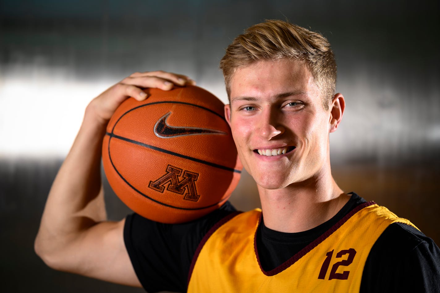 Gophers basketball player Luke Loewe stands for a portrait Thursday, Oct. 21, 2021 at the University of Minnesota Athletes Village in Minneapolis, Minn. Loewe transferred to Minnesota, in part, because of the proximity to lakes. He's looking to make NIL money with a "Buckets-n-Bass " promotion. ] AARON LAVINSKY • aaron.lavinsky@startribune.com