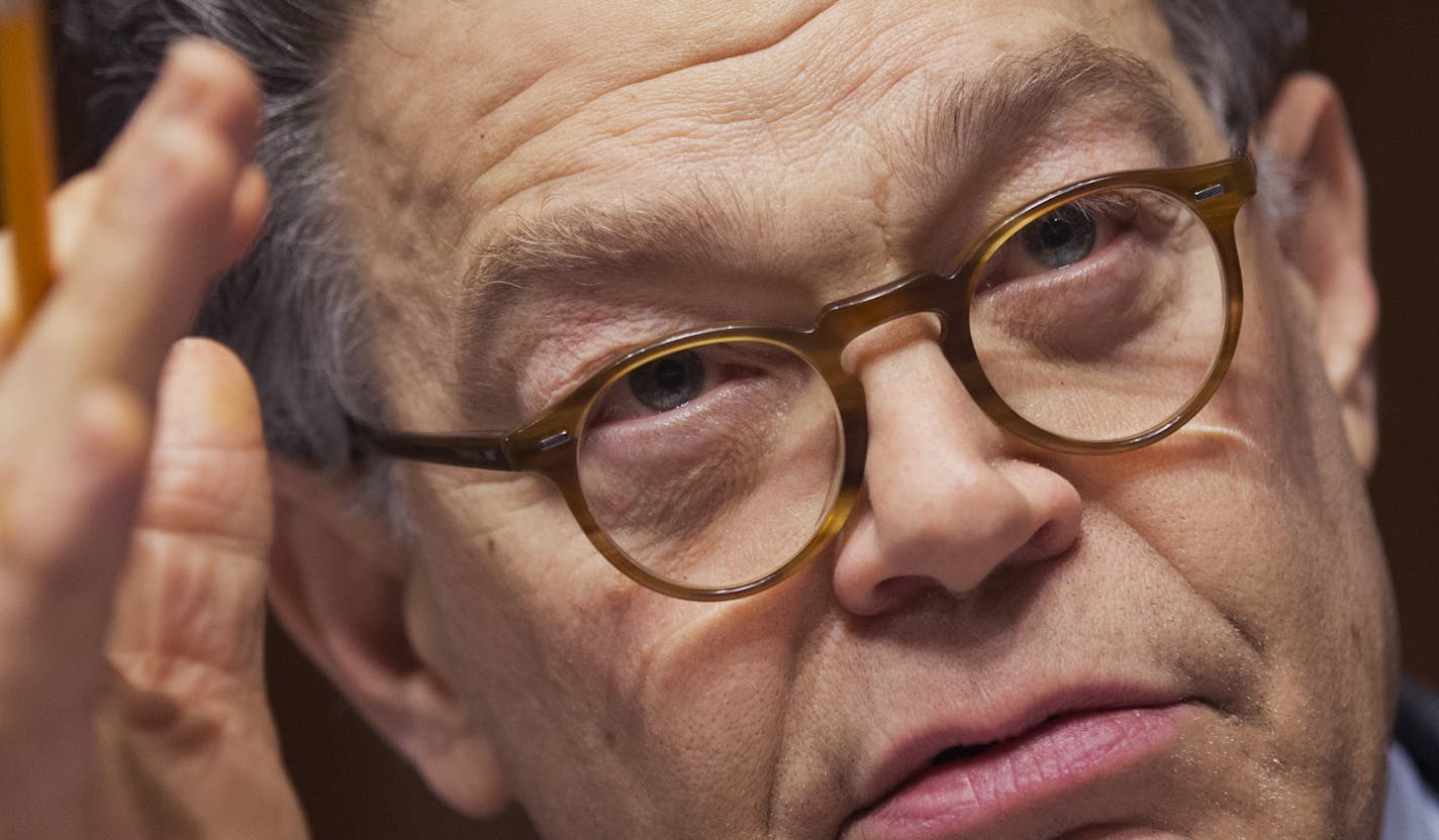 Senate Judiciary Committee member Sen. Al Franken, D-Minn., questions panel of witnesses during the committee's hearing on "Continued Oversight of U.S. Government Surveillance Authorities" Wednesday, Dec. 11, 2013, on Capitol Hill in Washington. (AP Photo/Manuel Balce Ceneta)