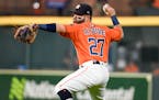 Houston Astros second baseman Jose Altuve throws out Los Angeles Angels' Brian Goodwin during the fifth inning of a baseball game Friday, Sept. 20, 20