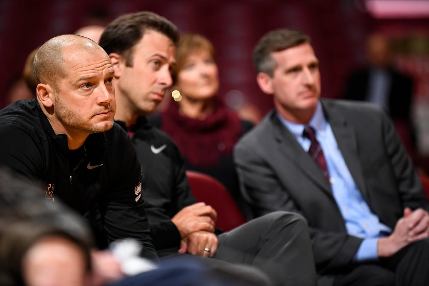 From left, Gophers football head coach PJ Fleck, basketball head coach Richard Pitino and athletic director Mark Coyle watched Lindsay Whalen's introductory news conference as the women's basketball head coach.