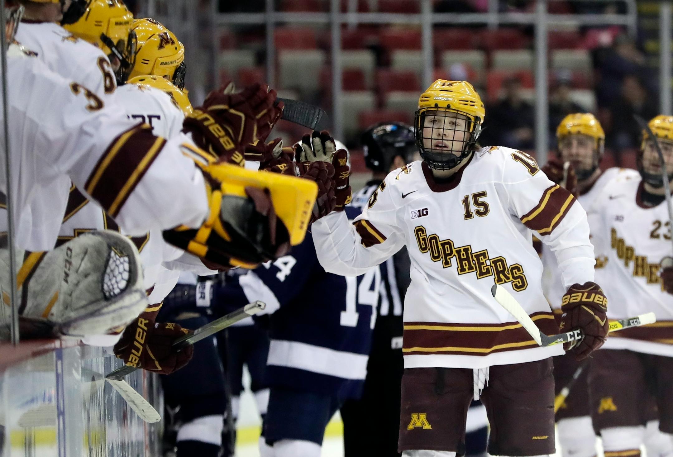 Minnesota forward Rem Pitlick is greeted by teammates after scoring a goal last season.