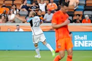 Loons forward Teemu Pukki celebrates his goal, near Houston Dynamo defender Daniel Steres during the first half Wednesday.