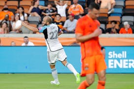 Loons forward Teemu Pukki celebrates his goal, near Houston Dynamo defender Daniel Steres during the first half Wednesday.