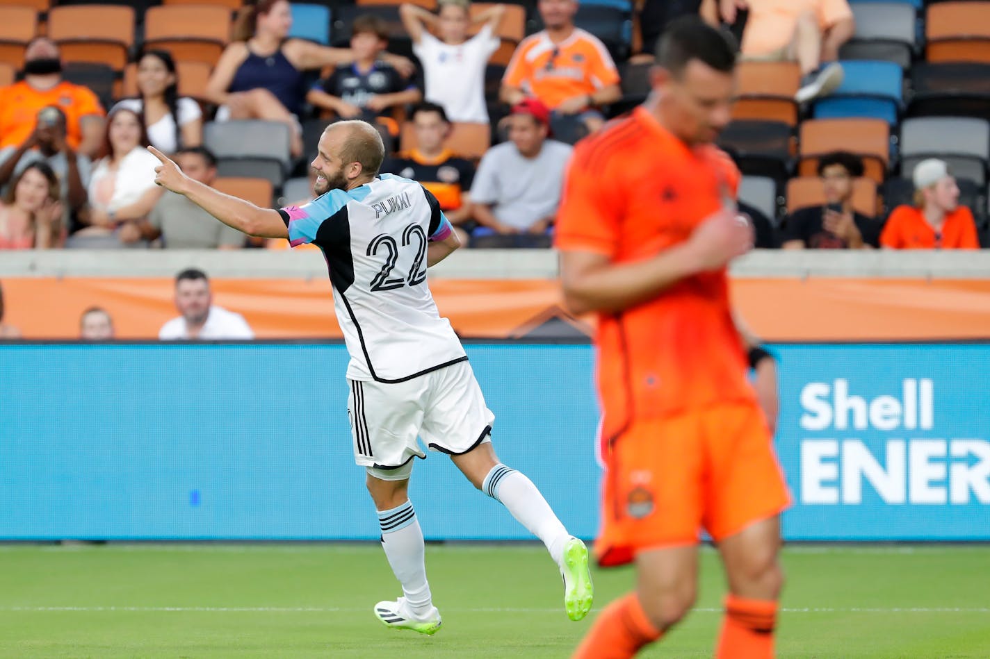 Loons forward Teemu Pukki celebrates his goal, near Houston Dynamo defender Daniel Steres during the first half Wednesday.