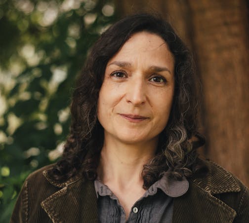 photo of author Angela Tomaski in front of a tree