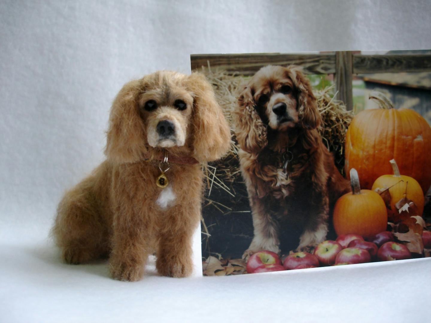 A model of Brandy Noel made by Lucy Francis next to a photo of the cocker spaniel who died on Oct. 11, 2008.